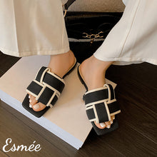 Load image into Gallery viewer, Black-White-Leather-Flat-Sandals-with-Thick-Woven-Design-model-shots