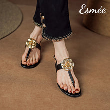 Load image into Gallery viewer, Black-Leather-T-Straps-Sandals-with-Golden-Flower-Design-model-shots
